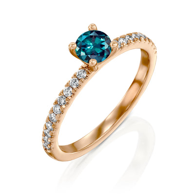 rose gold alexandrite ring on a white background