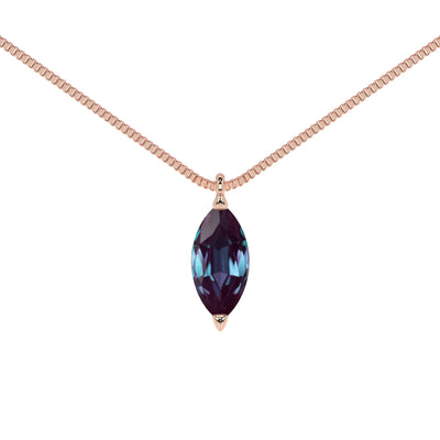 Necklace with a marquise-shaped alexandrite birthstone gemstone in rose gold pendant on a white background