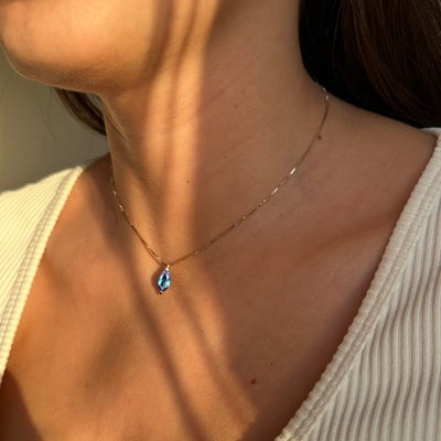 Alexandrite Necklace in 14k yellow gold worn by a woman