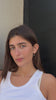 Video of a model wearing a floating diamond heart necklace transitioning to a Close-up of showcasing the diamond and chain
