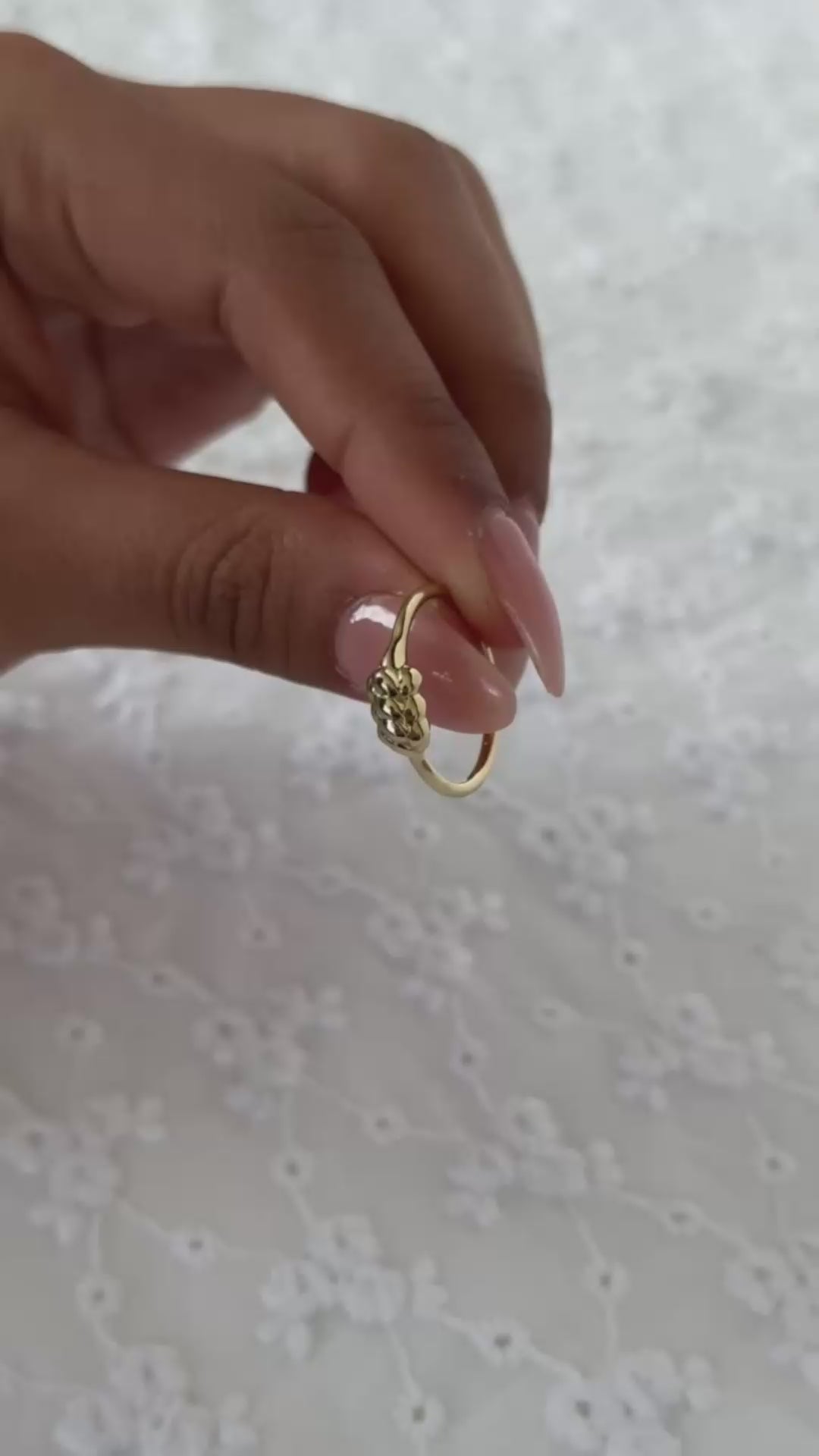 women holding a 14k yellow gold challah ring