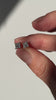 1 carat princess cut diamond studs held in hand