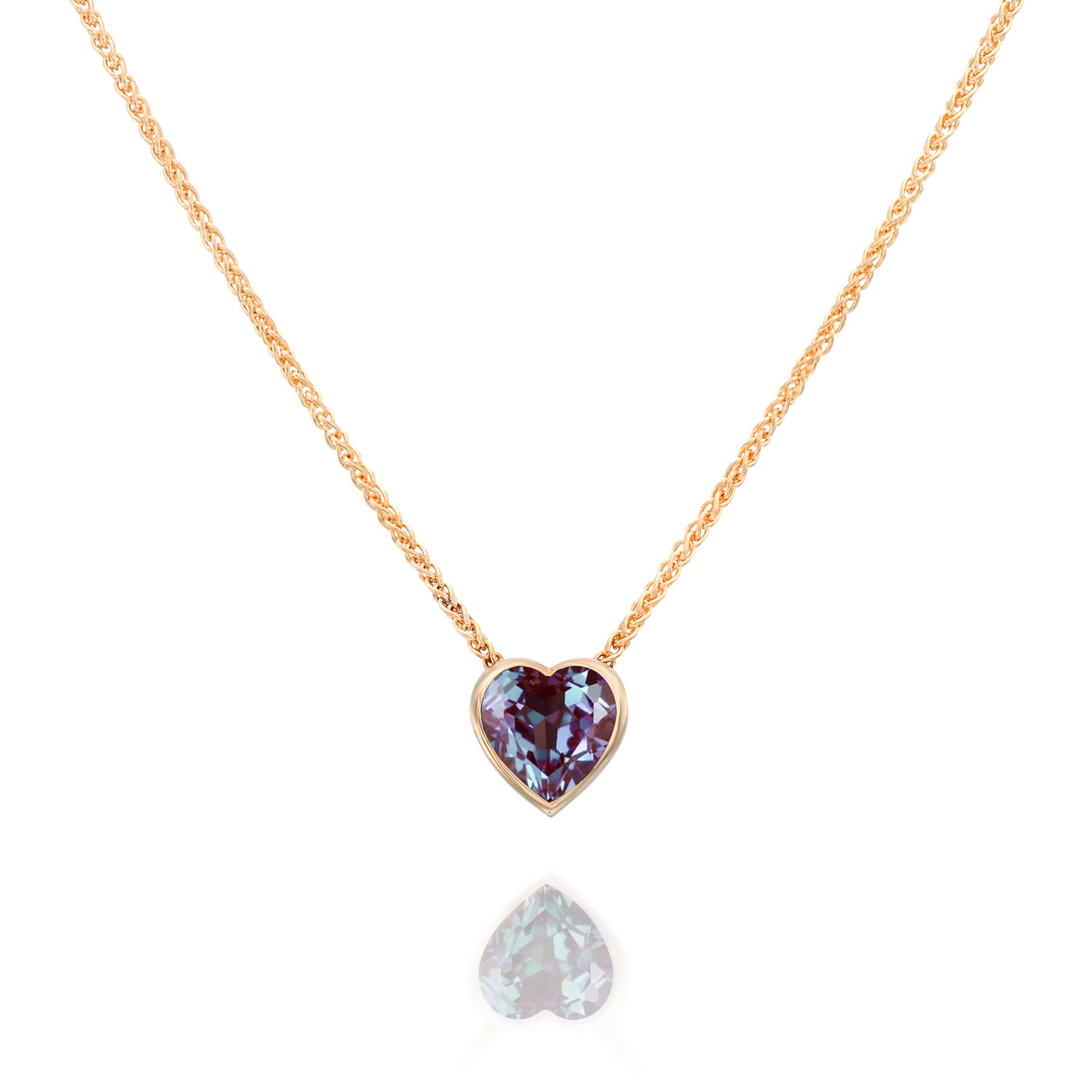 Necklace with a heart-shaped purple gemstone pendant on a white background