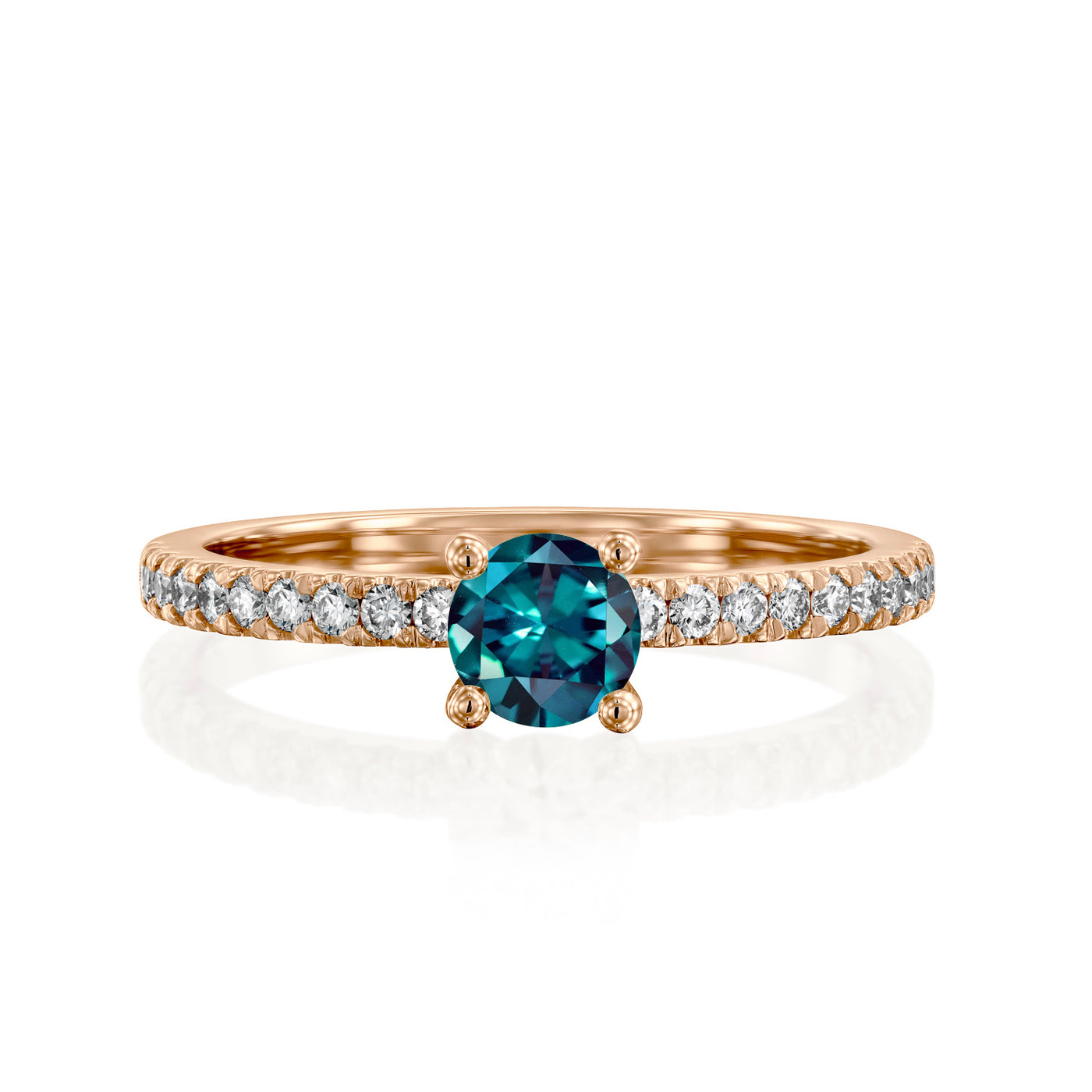 rose Gold ring with a teal gemstone on a white background