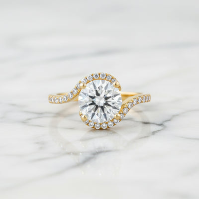 diamond moissanite engagement ringon a marble surface