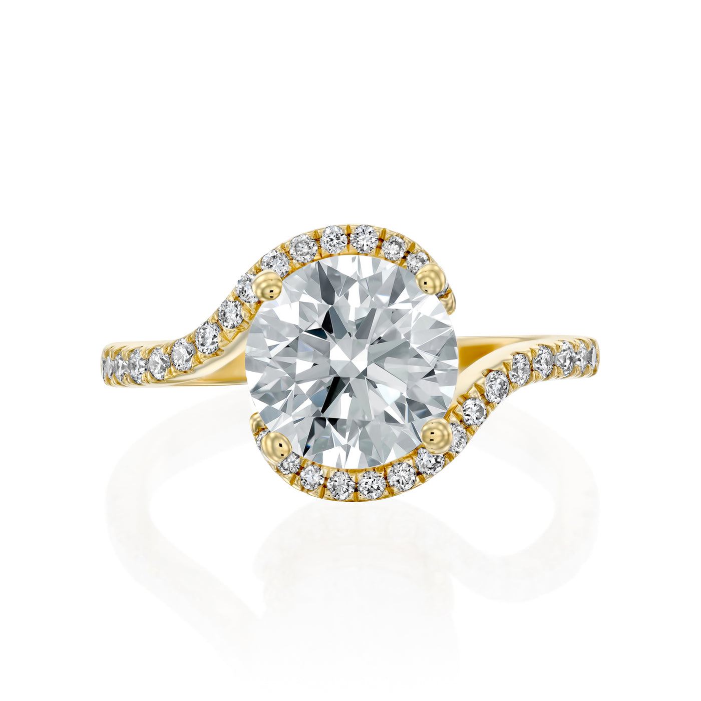 Gold ring with a 2ct moissanite and a smaller diamond halo on the band against a white background