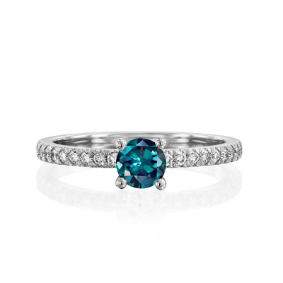 alexandrite ring with diamonds in white gold on a white background