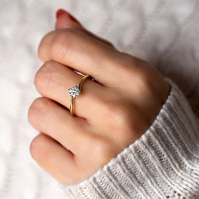This is a unique twist engagement diamond ring, set in a 14K/18K solid gold band, the perfect dainty classic Solitaire bridal ring.