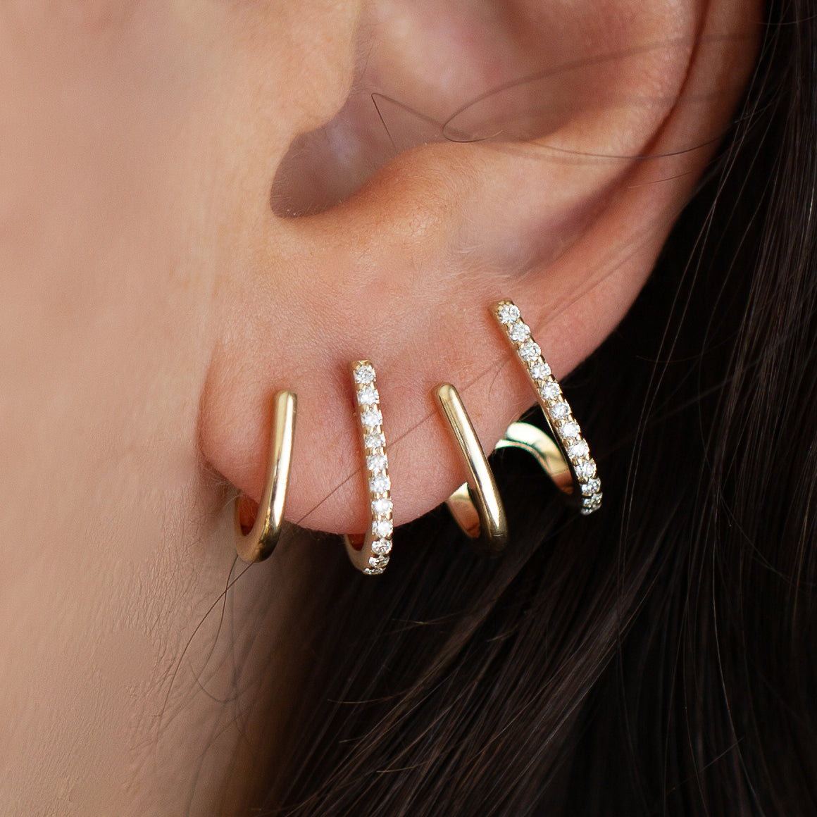 These minimalist solid 14K gold unique diamond illusion earring is the perfect multi-hoop claw stud hoops.