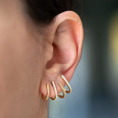 These minimalist solid 14K gold unique diamond illusion earring is the perfect multi-hoop claw stud hoops.