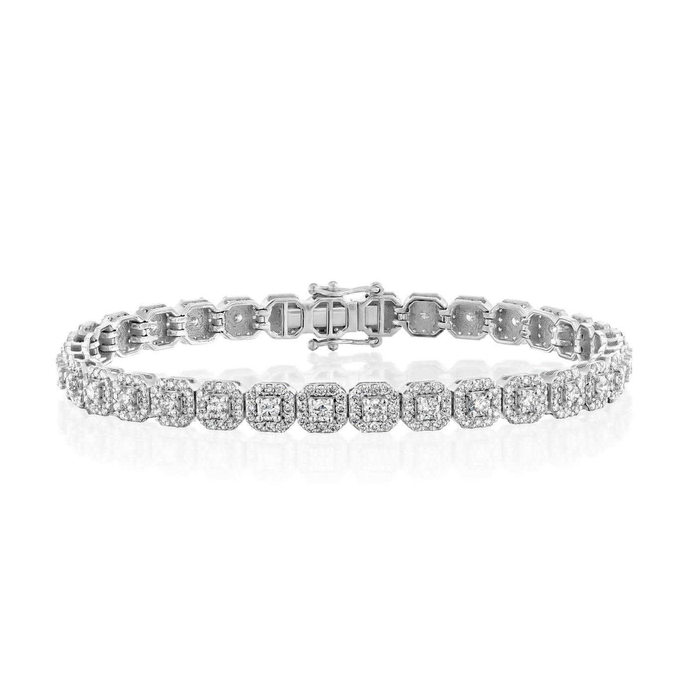 This unique diamond tennis bracelet features stunning pave set diamond clusters on cushion shape links that sparkle and shine with every movement.
