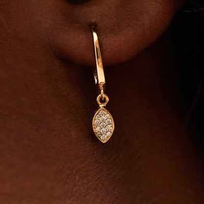 These minimalist solid 14K gold diamond charm dangle earrings are the perfect bridal marquise solid gold drop earrings.