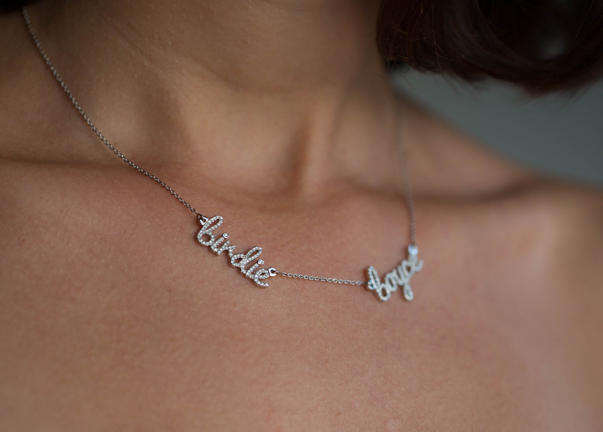 women wearing a double name custom diamond necklace, in 14k gold, the perfect new mom necklace